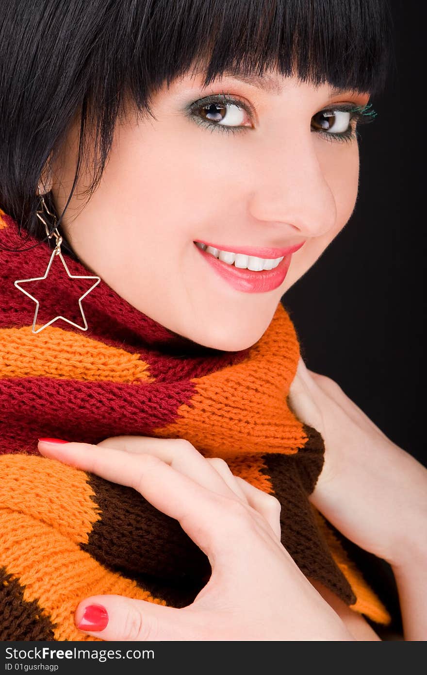 Portrait of the woman with scarf on black background