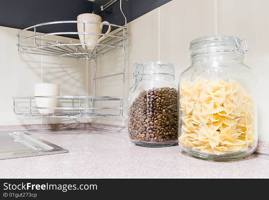 Pasta and coffee beans in glass jars