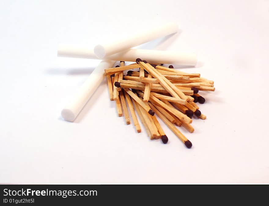 Small heap of wooden sticks - matches and cigaretttes