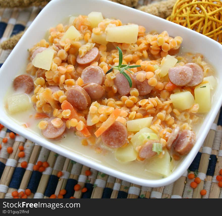 A fresh stew of red lentils with sausauge and potatoes