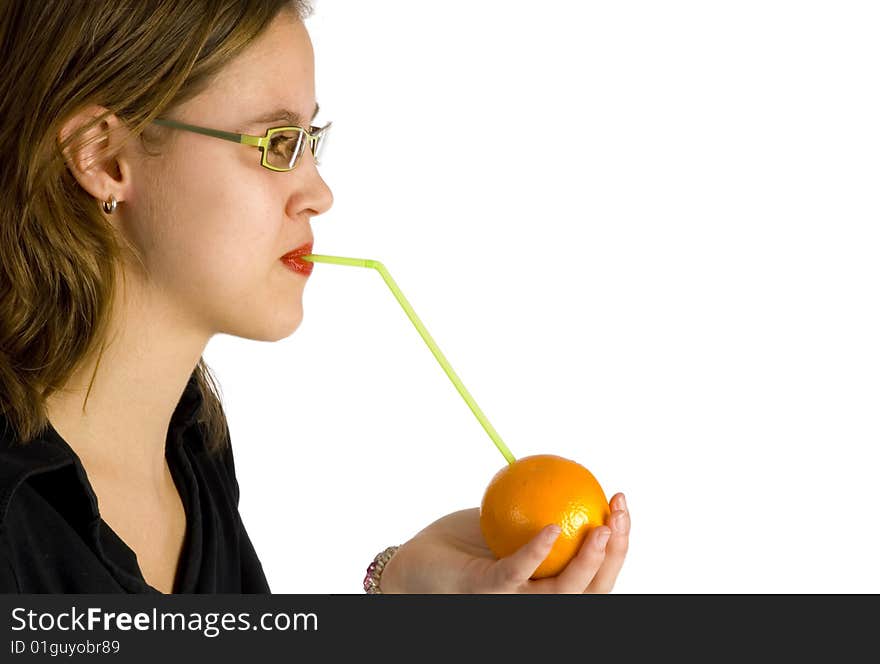 Nice girl drinking direct from the fruit