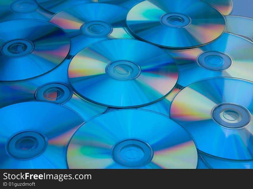 Lots of cd disks in blue light.