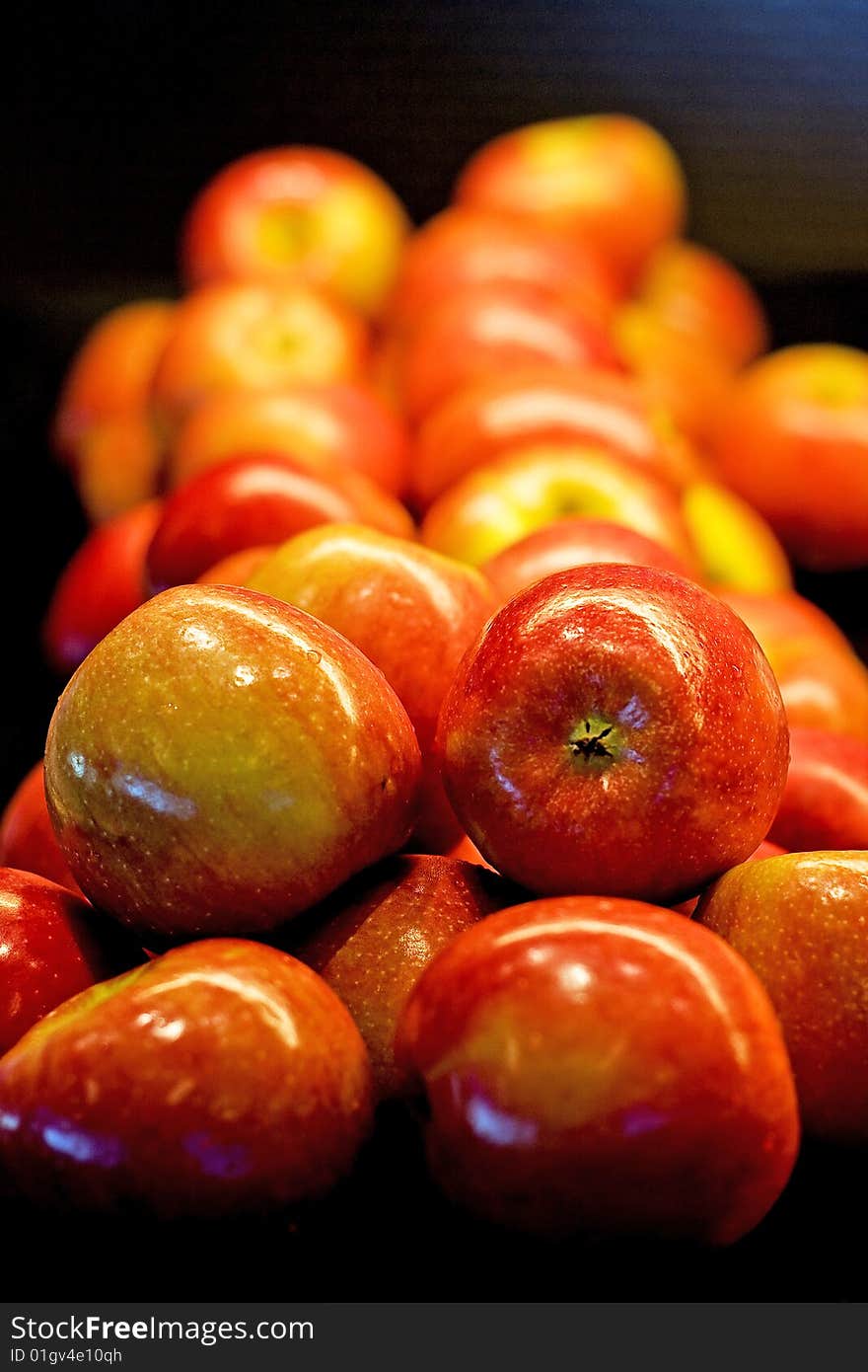 Row of Fresh Apples on Black