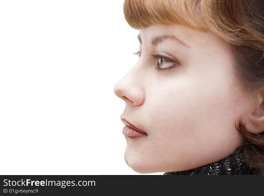 Portrait of young attractive woman in profile pose