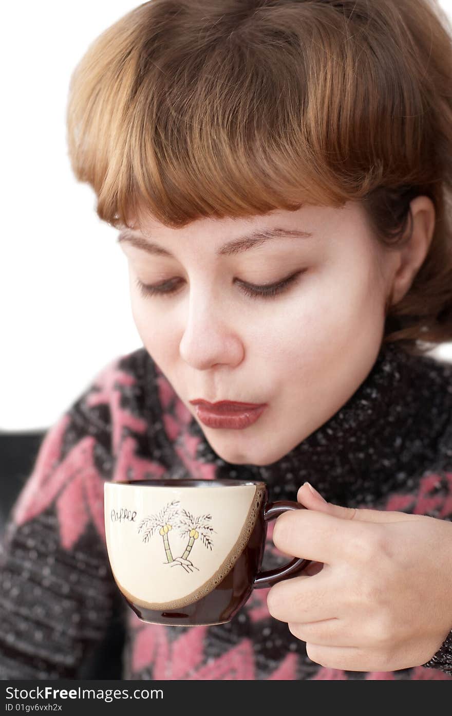 Young attractive woman drinking coffee