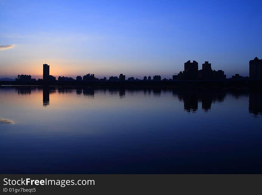 The sunset、skyline and an inverted reflection in water neer the dock named ManKan. The sunset、skyline and an inverted reflection in water neer the dock named ManKan