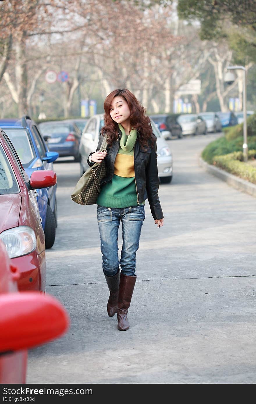 Young asian women with car in street