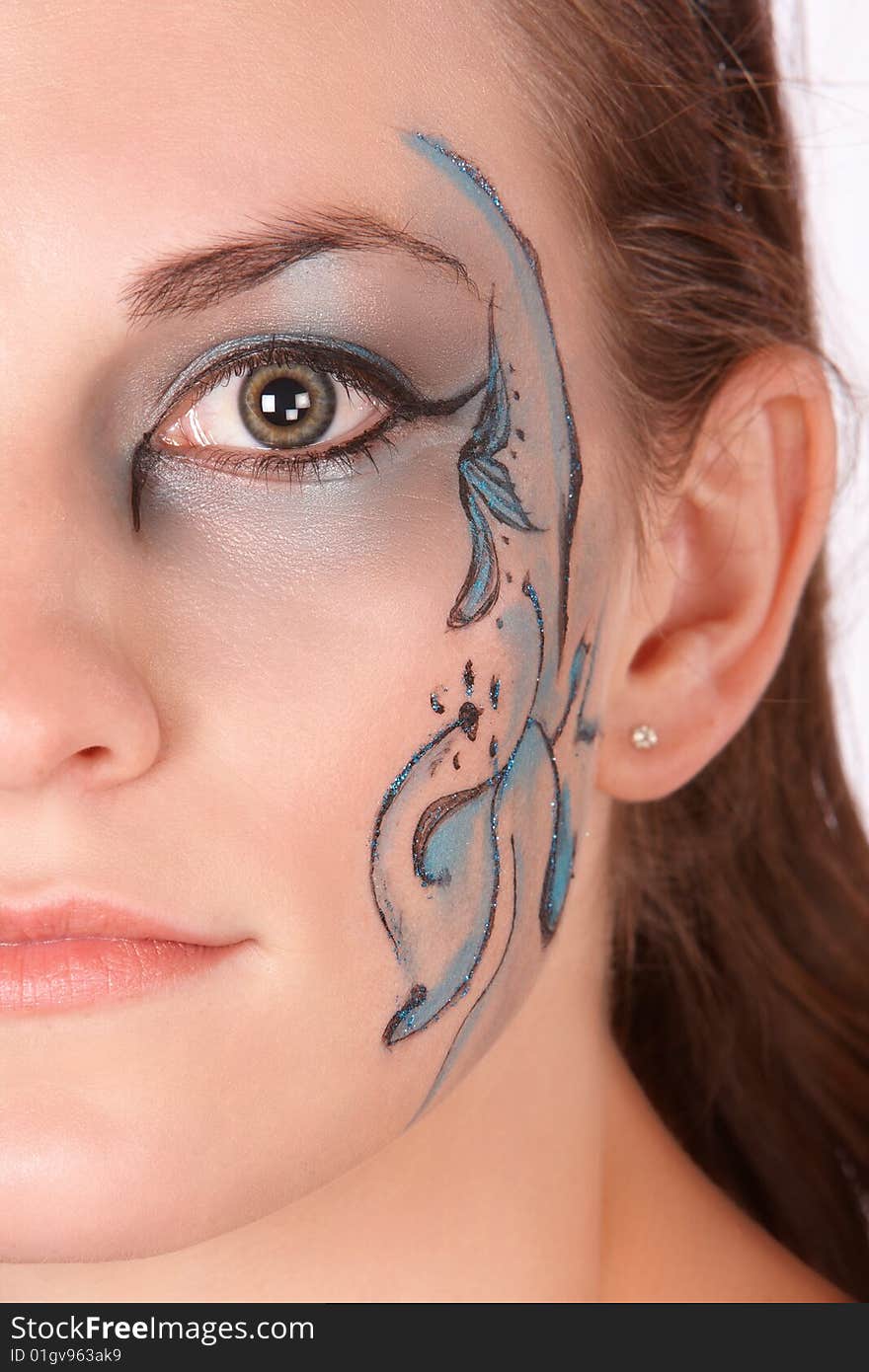 Brunette with blue makeup only halve face fantacy