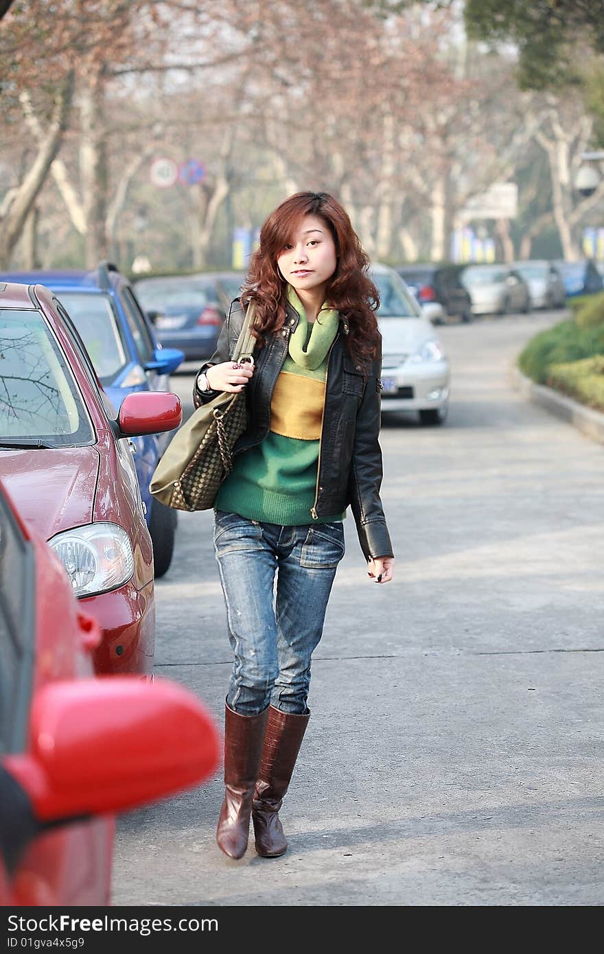 Young asia girl with car in street. Young asia girl with car in street