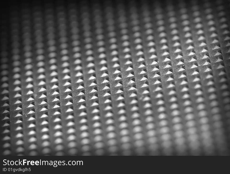 Fine close up image of metal dotted plate background. Fine close up image of metal dotted plate background