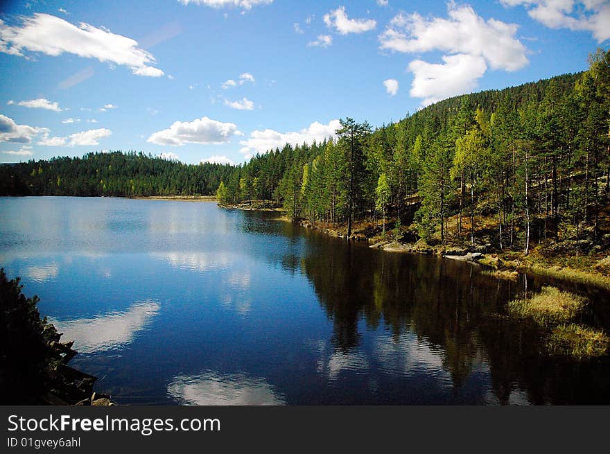 The clear river reflect the blue sky. The clear river reflect the blue sky