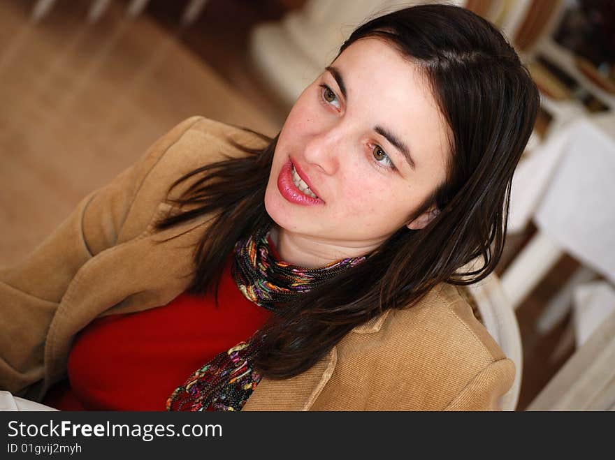 Young woman talking while siting