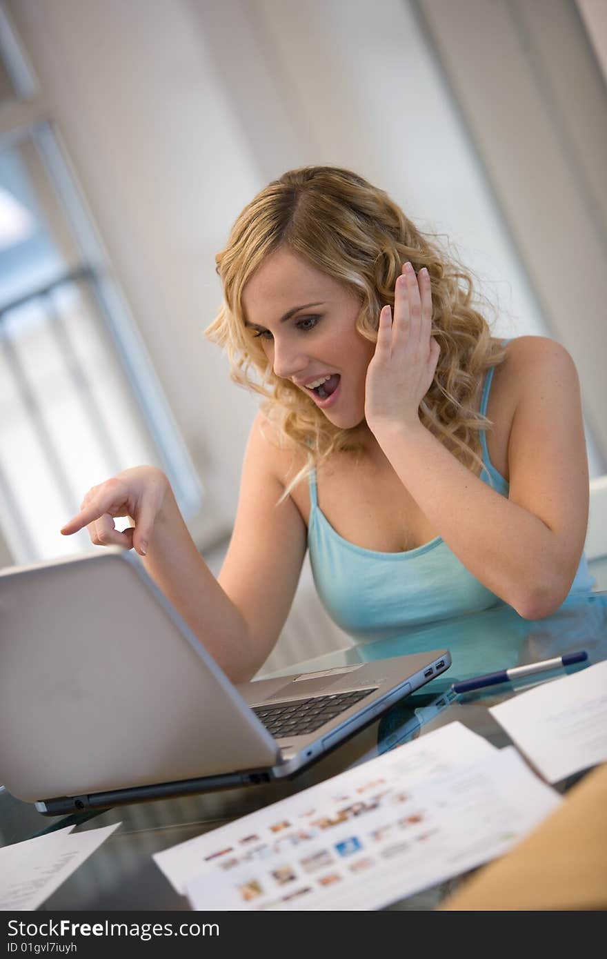 Woman surprised at laptop