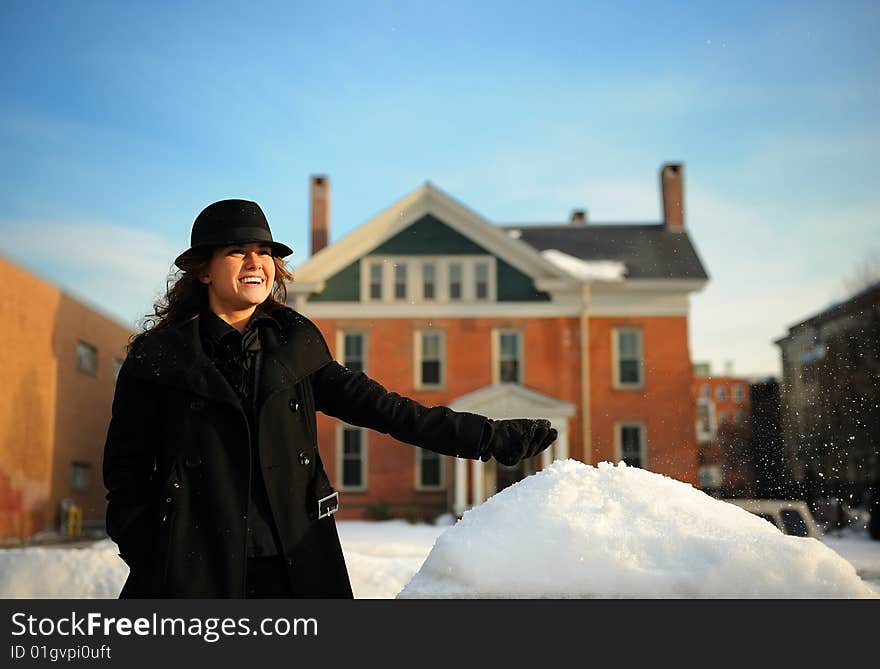 Happy young women throws the snow up. Happy young women throws the snow up