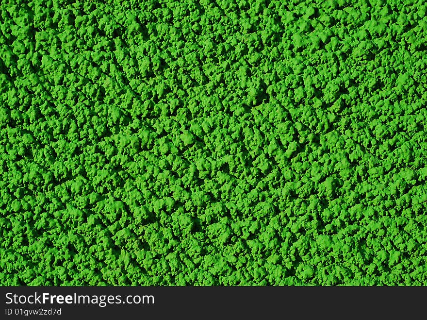 Green background texture. shote taken on the wall of a colored house. Green background texture. shote taken on the wall of a colored house