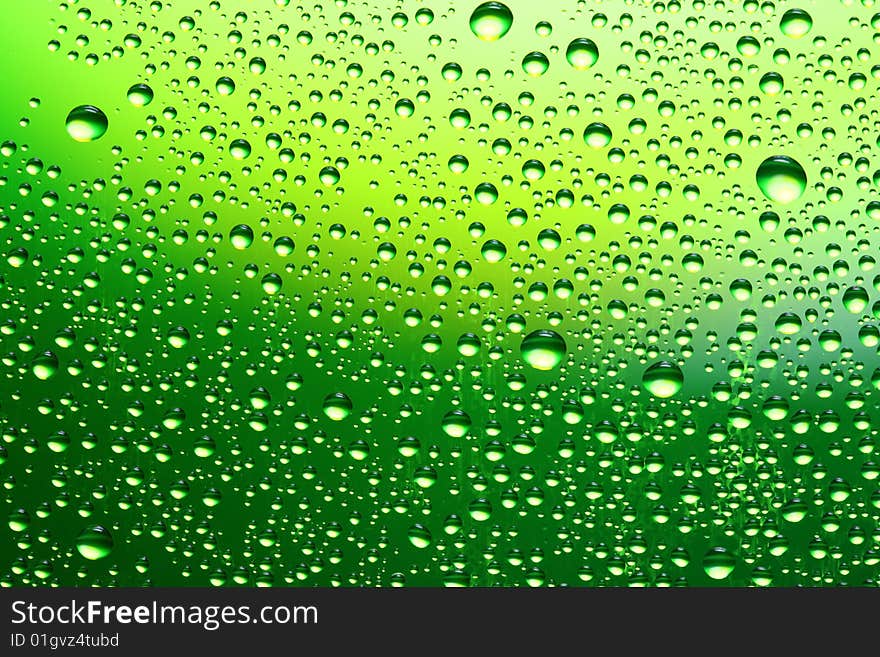 Drops of water on a green background. Drops of water on a green background.