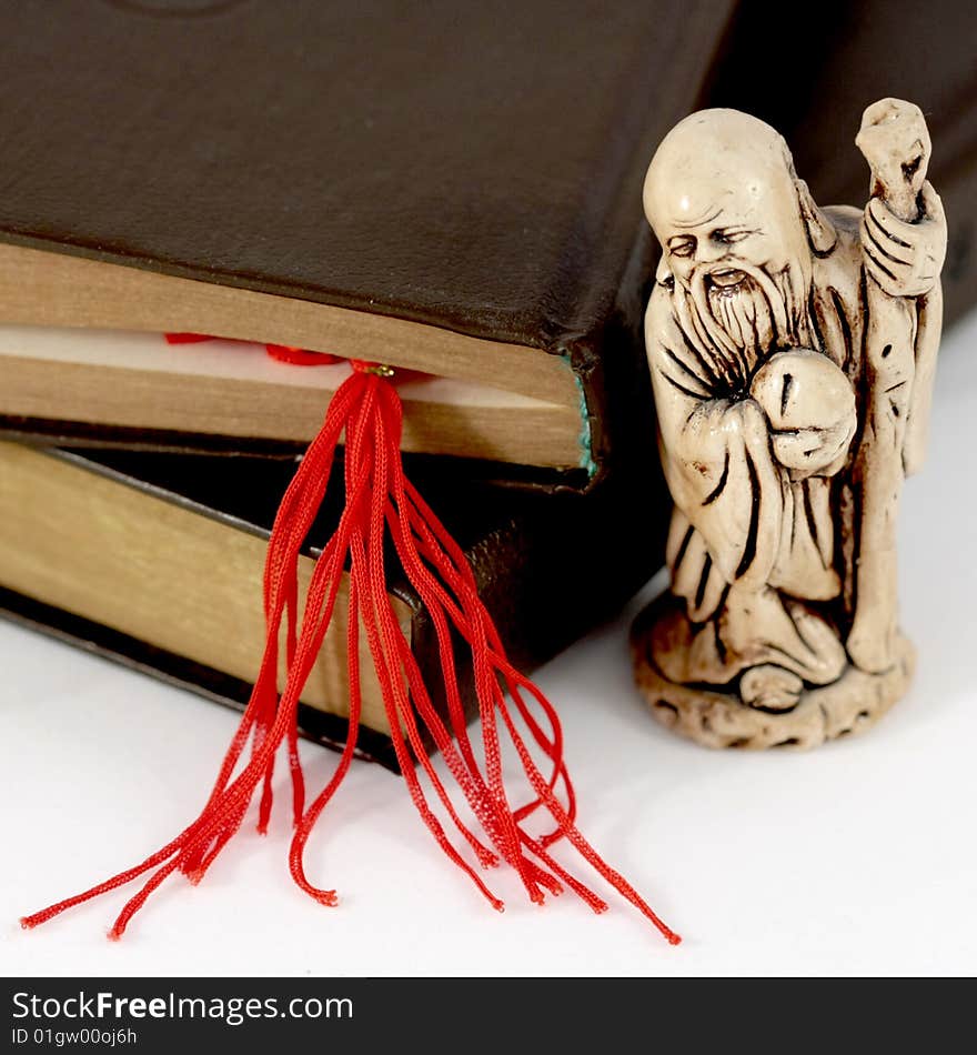 Netsuke, books and red bookmark