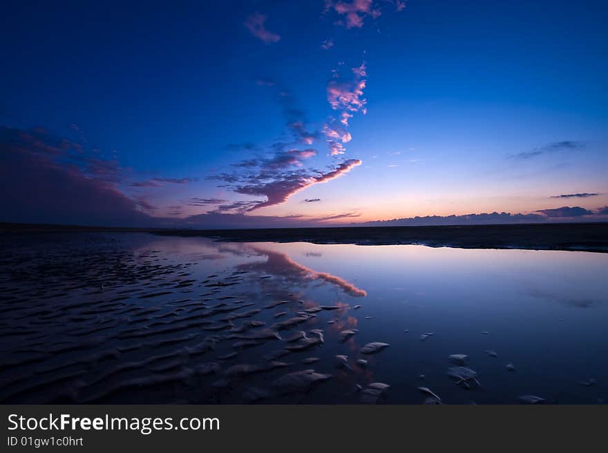 Sunset on the beach in the netherlands