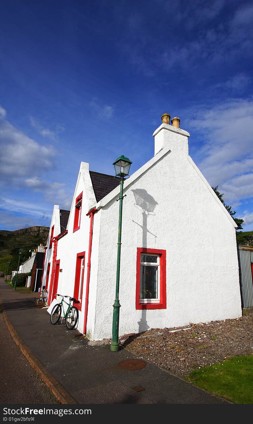 A white house in the main street of shieldaig in Scotland.