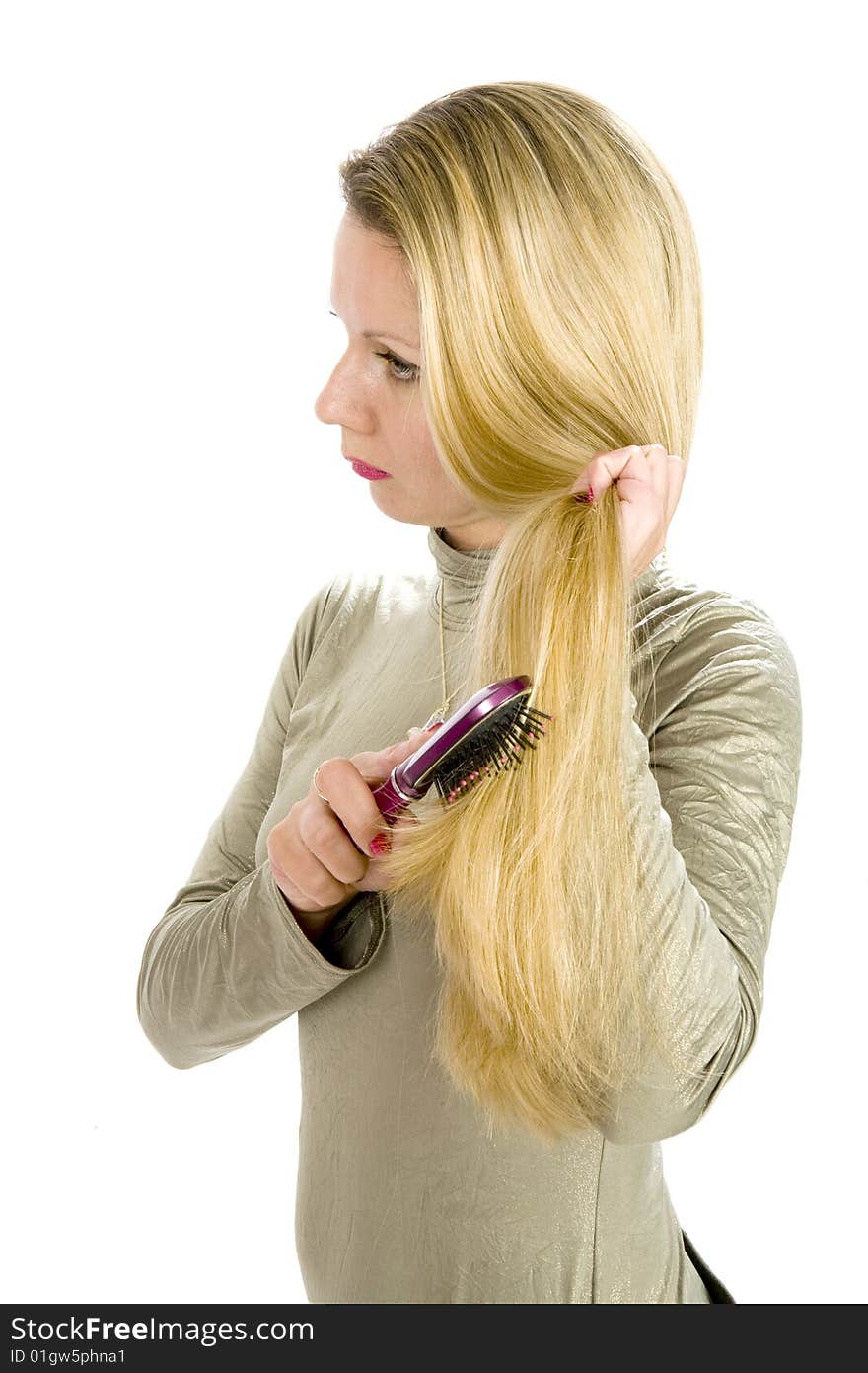 Long hair blonde woman with hairbrush in her hand. Long hair blonde woman with hairbrush in her hand