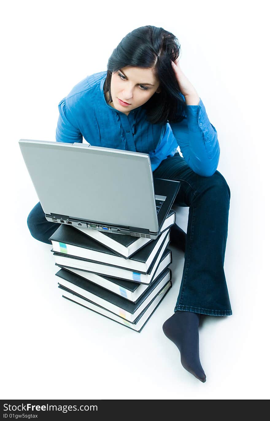 Young woman with notebook siting on the floor