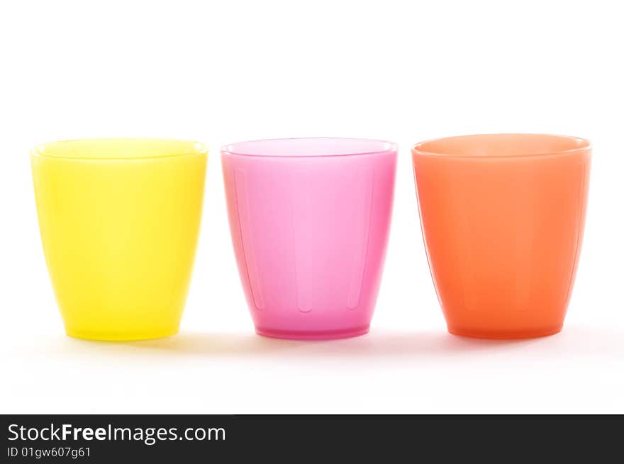 Plastic cups of various colors isolated on white