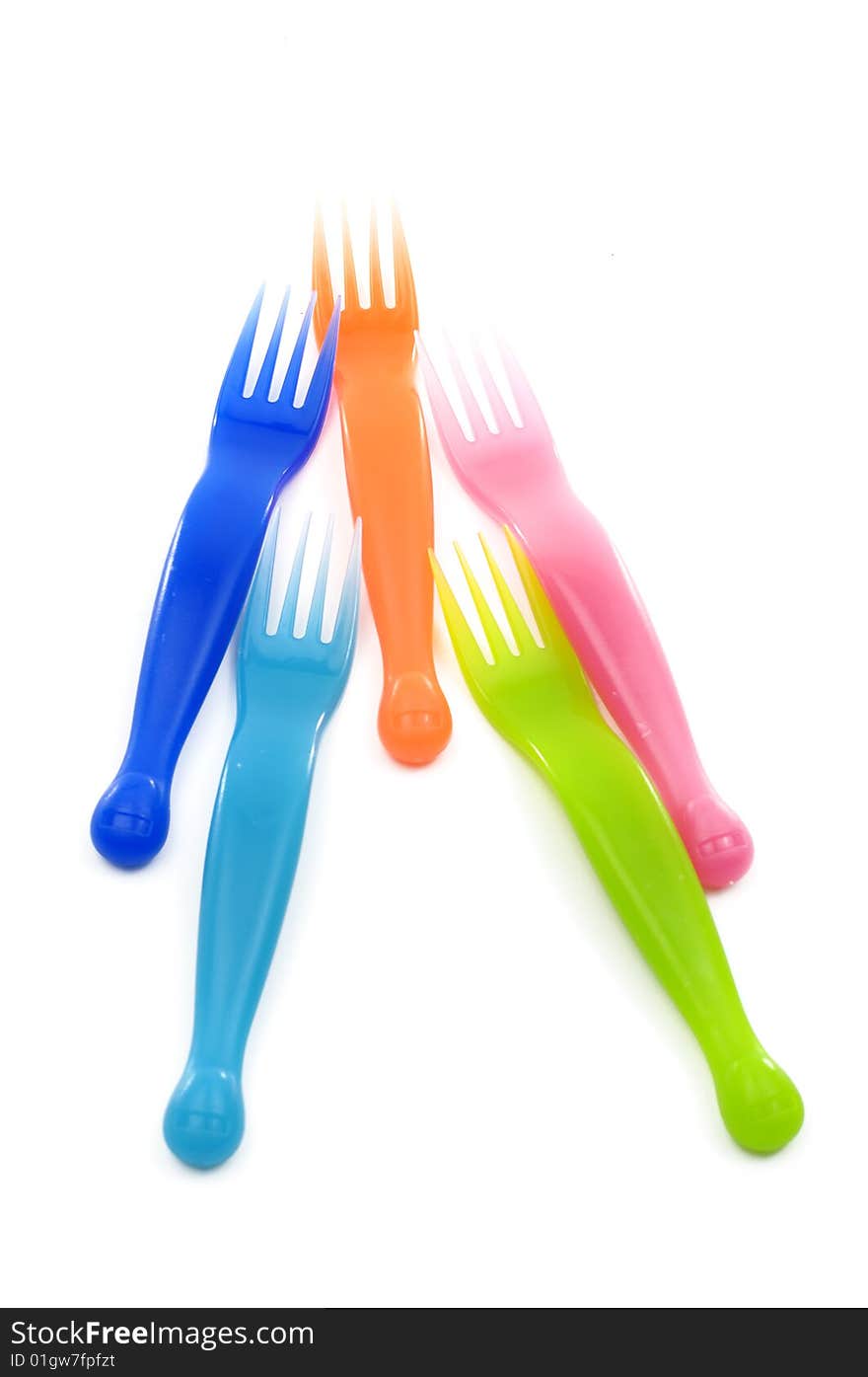 Colorful plastic forks on white. Colorful plastic forks on white