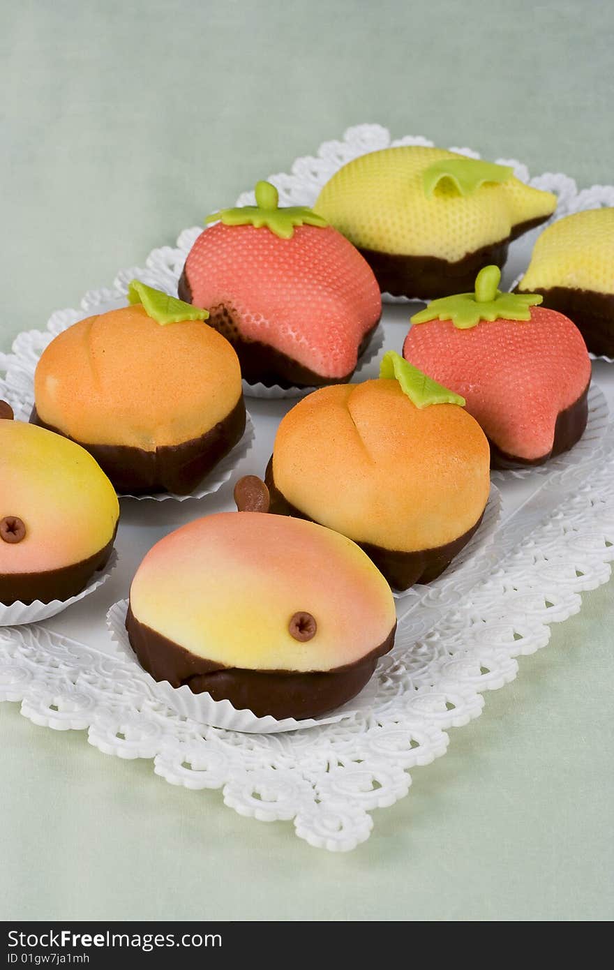 Sweet and fruit deserts on the white plate. Sweet and fruit deserts on the white plate