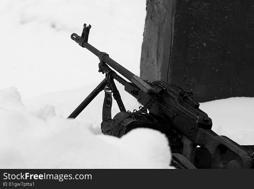 Weapon emplacement: russian army machinegun on snow ready to fire