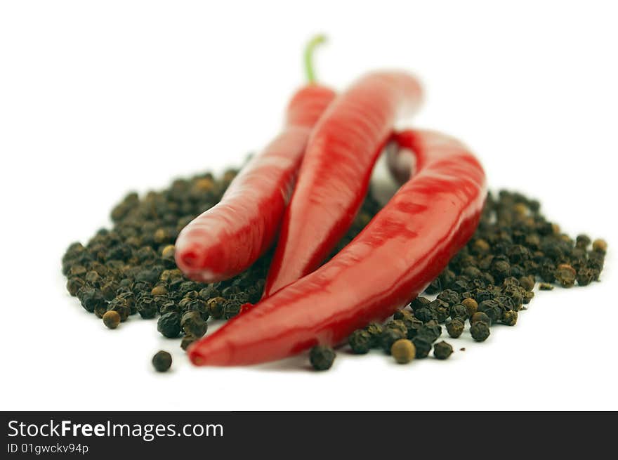 Black and red pepper on a white background