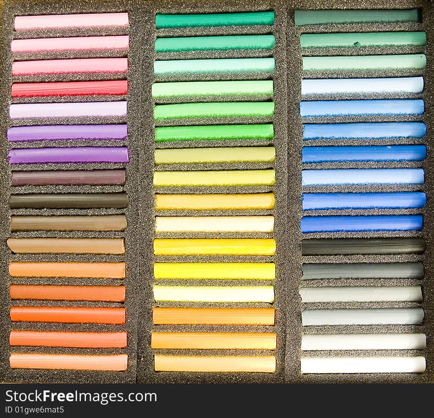 Soft pastels in black box