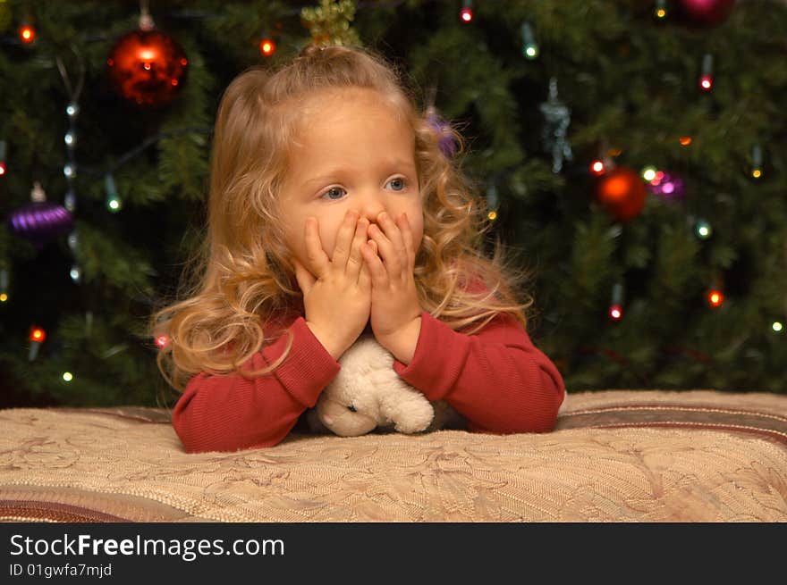 A two-and-a-half year old girl tests out her own poses and expressions in front of the camera while having her portrait taken. A two-and-a-half year old girl tests out her own poses and expressions in front of the camera while having her portrait taken.