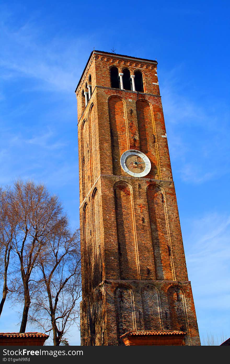 An old, brick made clock tower. An old, brick made clock tower