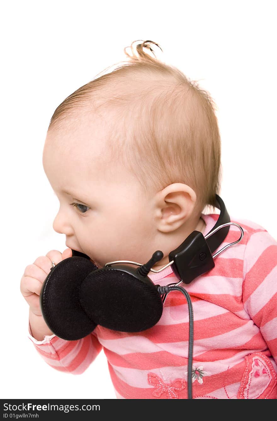 Baby with headphones on white