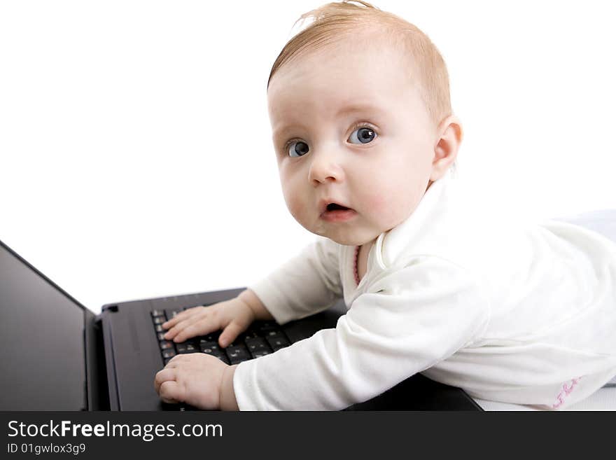 Little baby with laptop on white