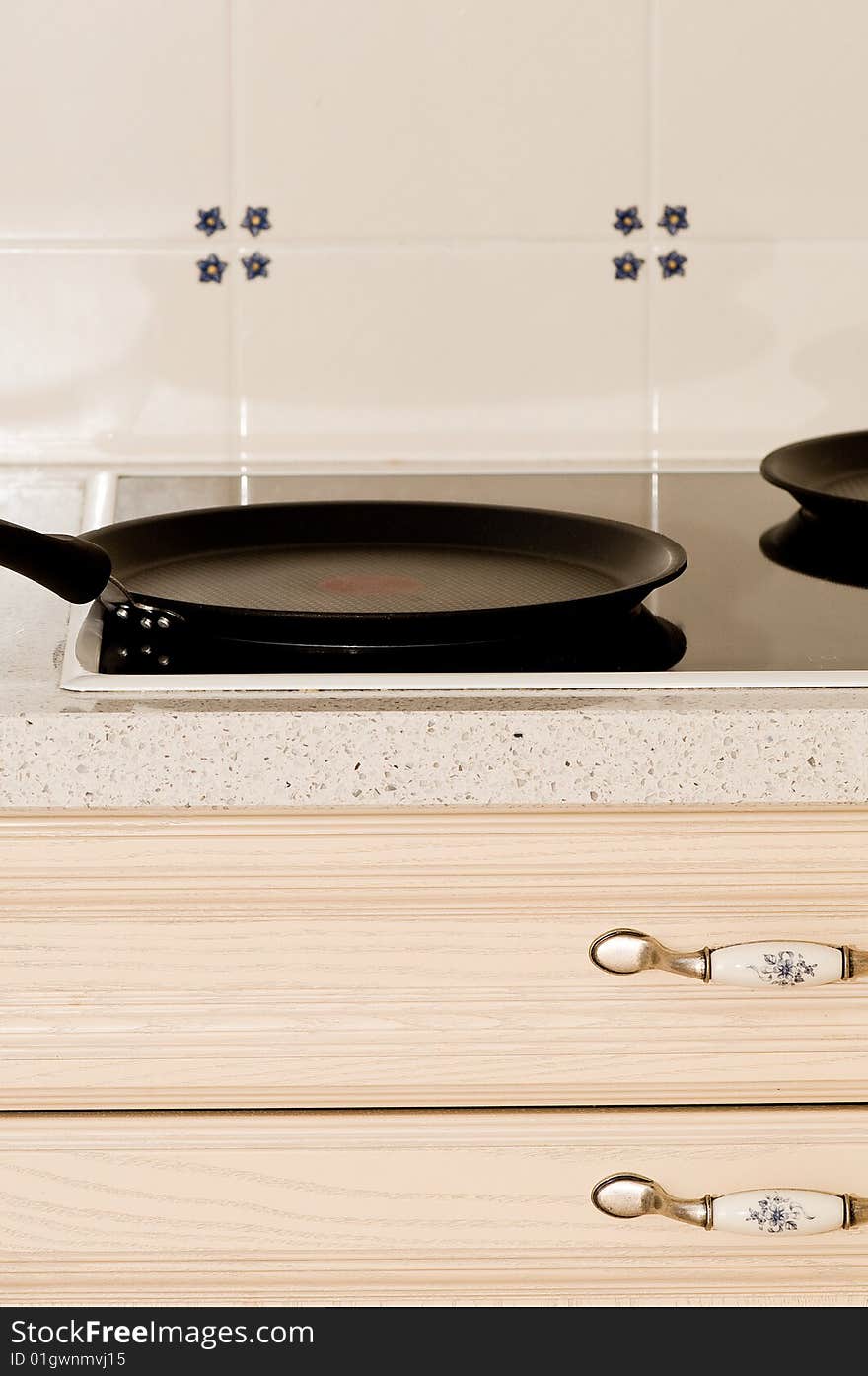 A frying pan on a stove in the kitchen