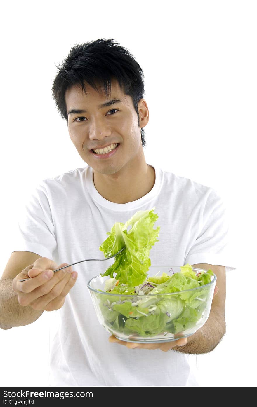 Young man holding fresh salad. Young man holding fresh salad