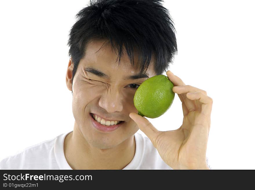 Young man holding fresh lemon. Young man holding fresh lemon