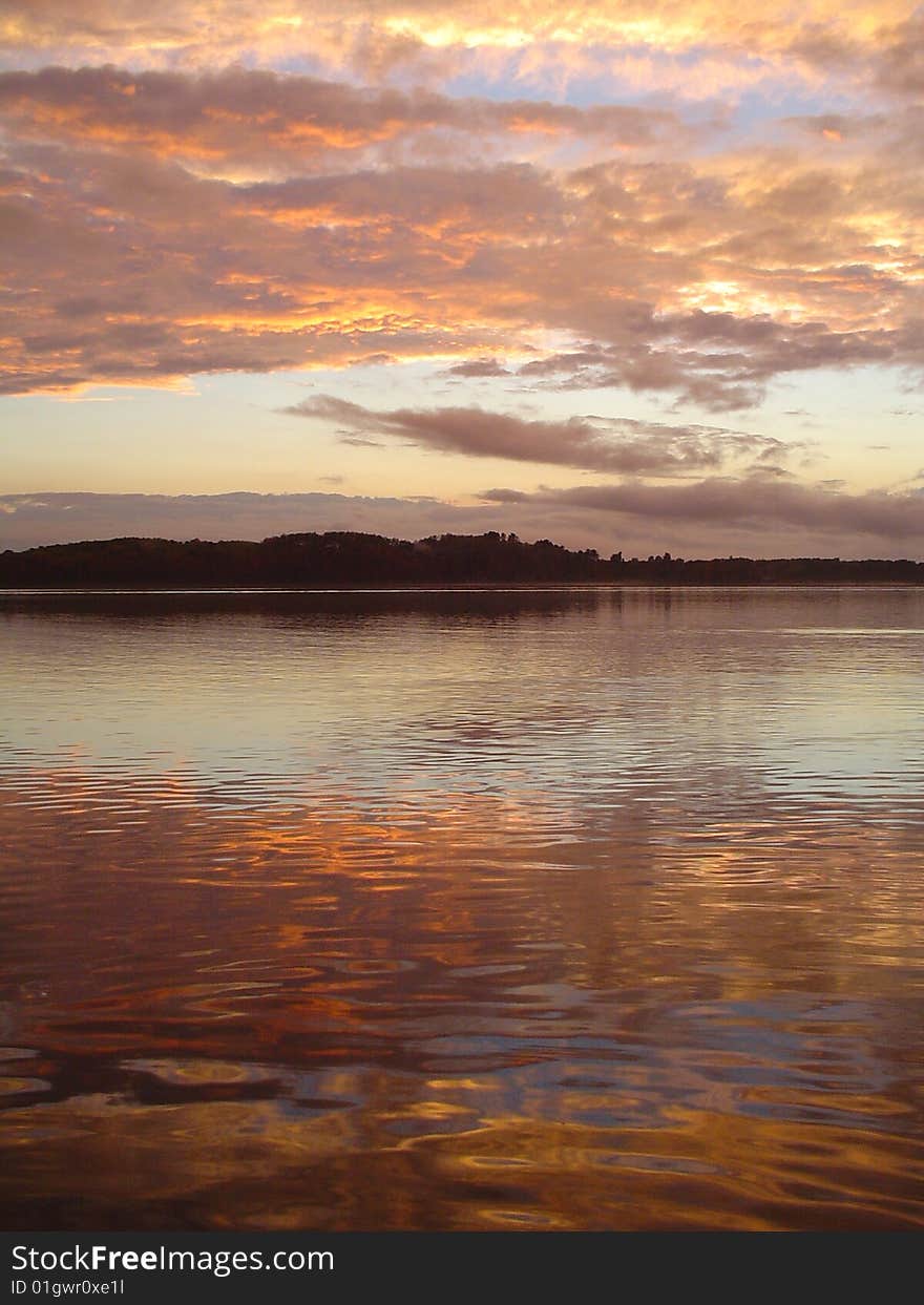 The evening was calm, and I was fishing with my dad and a friend.  The beauty of the evening could hardly be captured through a camera lense, but I did my best. The evening was calm, and I was fishing with my dad and a friend.  The beauty of the evening could hardly be captured through a camera lense, but I did my best.