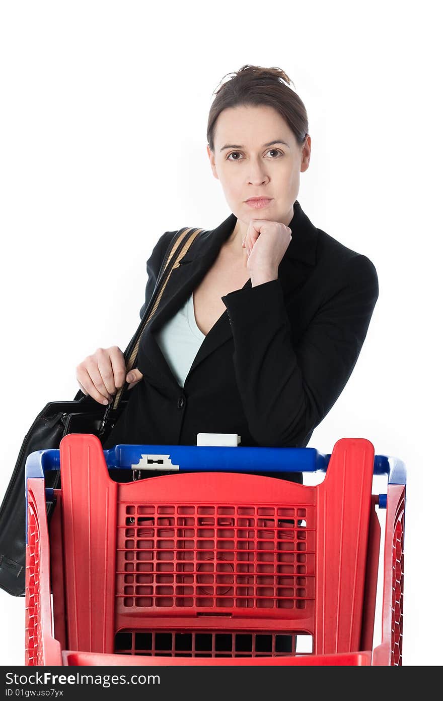 A woman in a business suit in a shopping scenario contemplating what to buy.