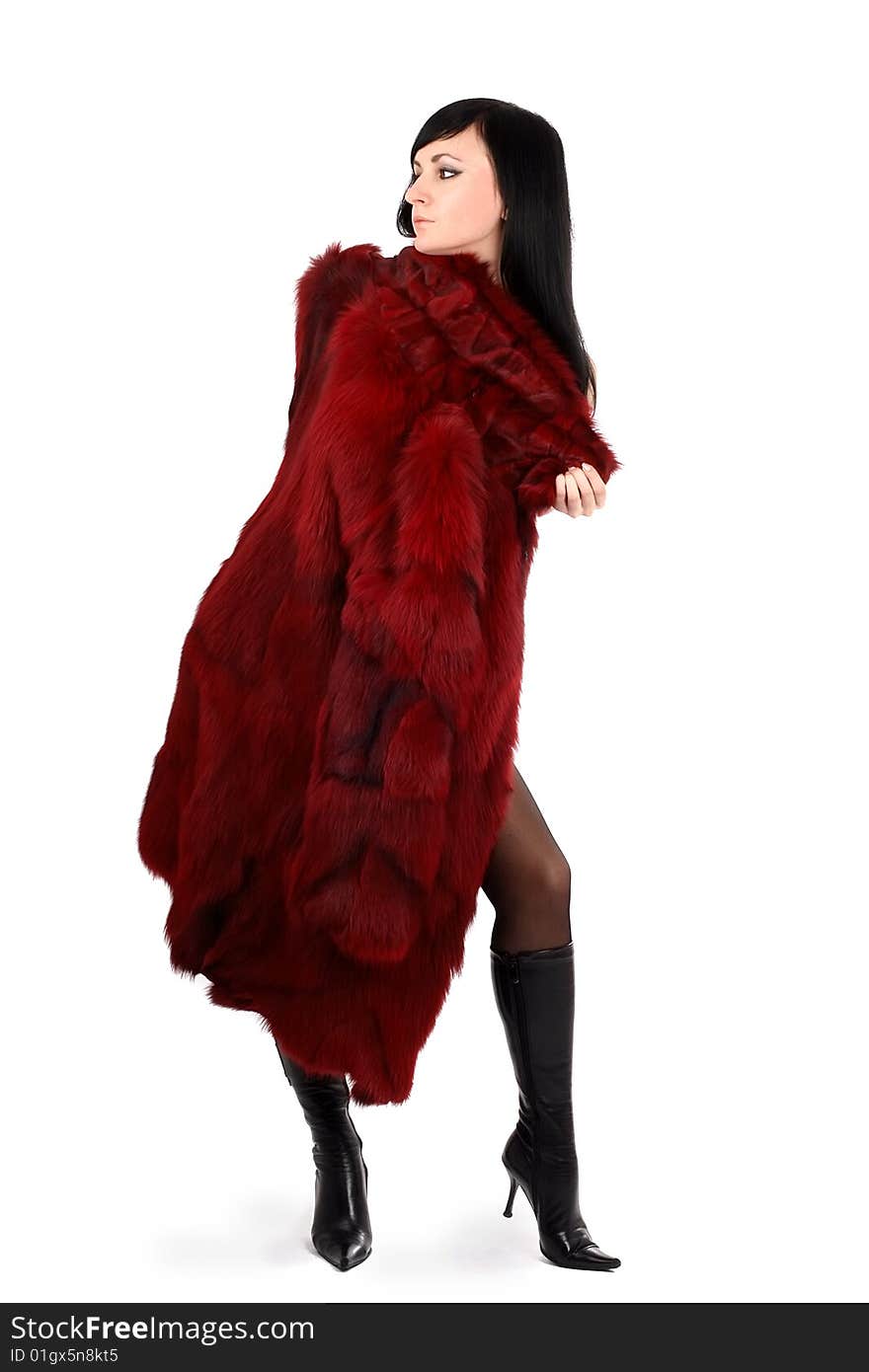 Brunette is in a red fur coat