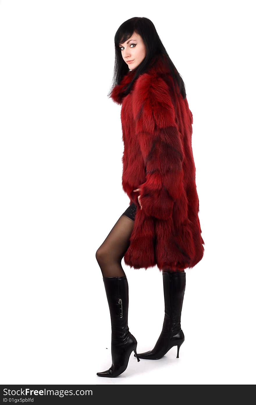 Brunette is in a red fur coat