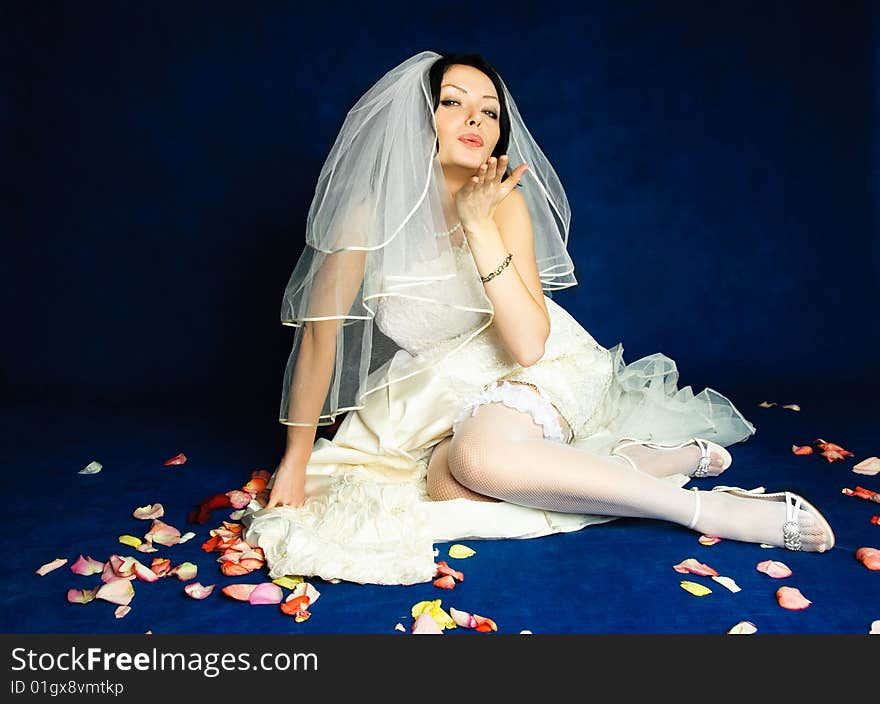 Beautiful bride sending an air kiss