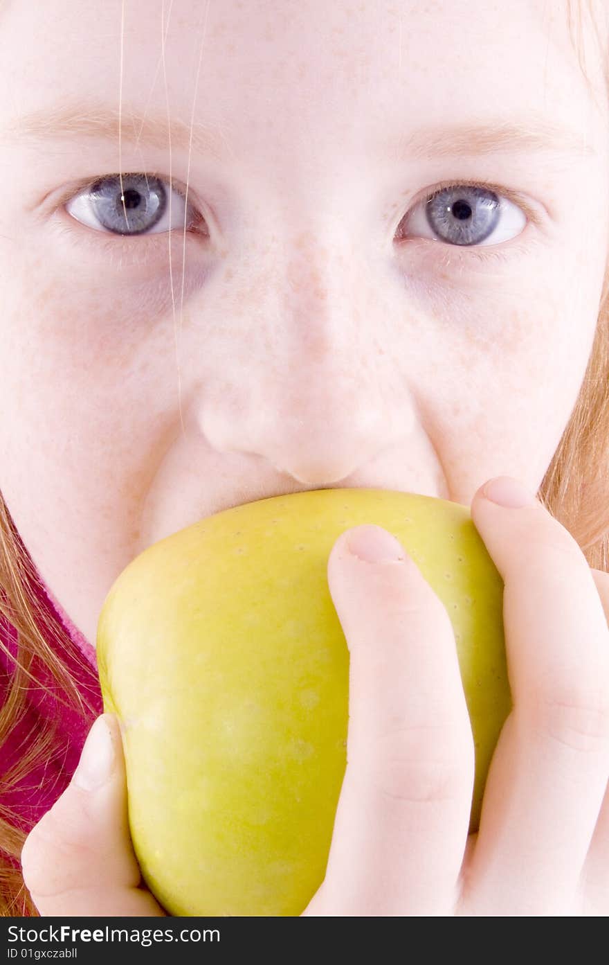 Girl biting an apple