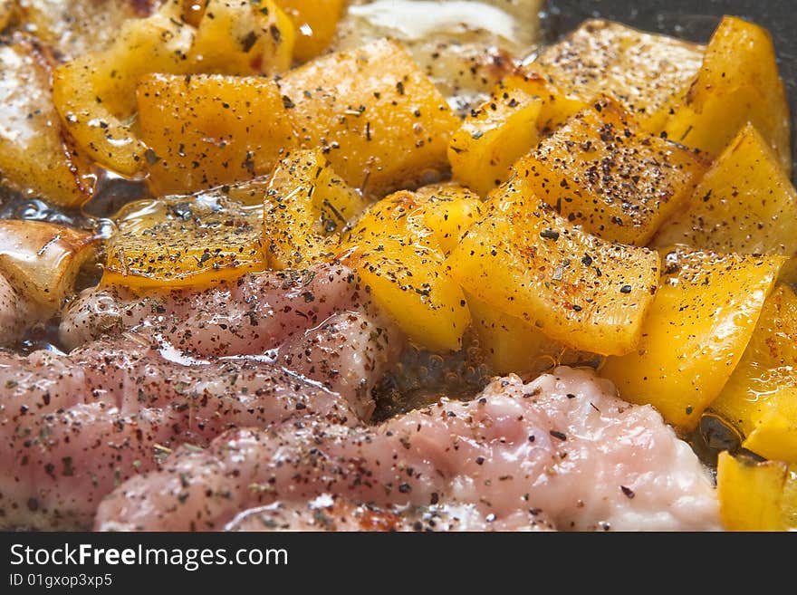 Pangasius filet frying with yellow peppers. Pangasius filet frying with yellow peppers