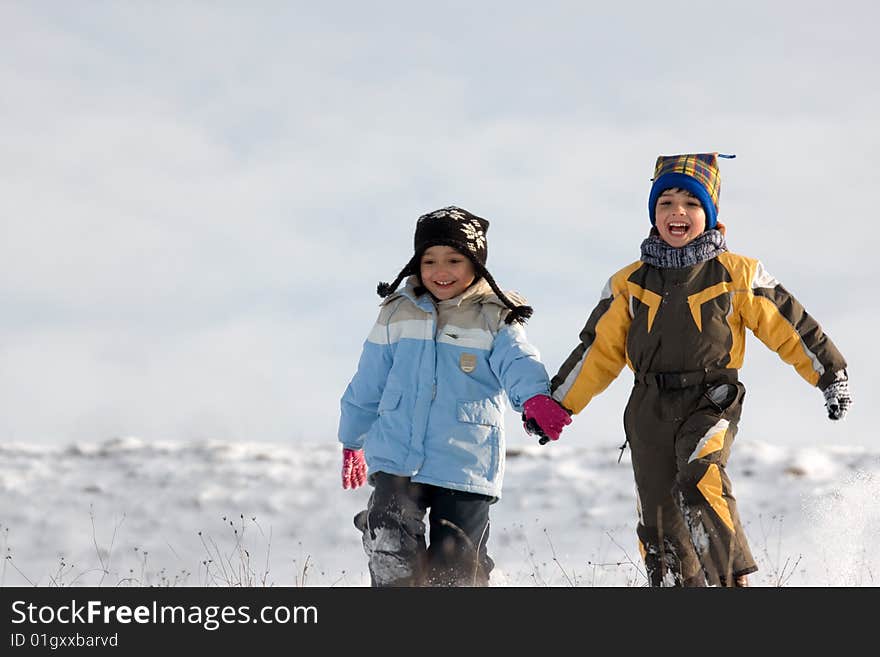 Running little boy and girl