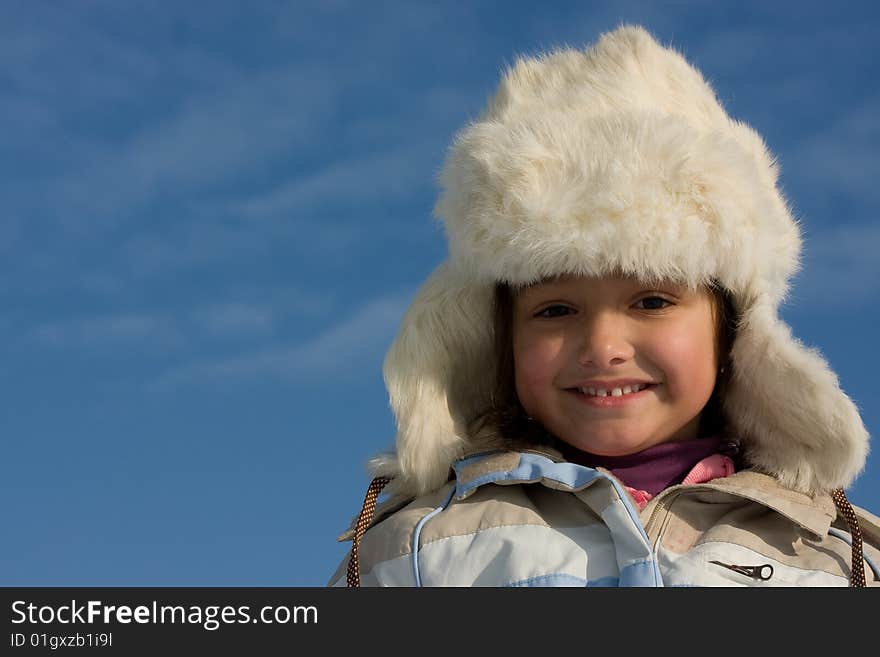 Smilling Girl Winter Portrait In The Fur-cap