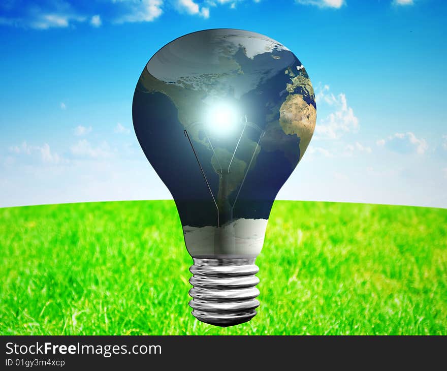 Light bulb with earth map at blue sky and green grass backgrouund