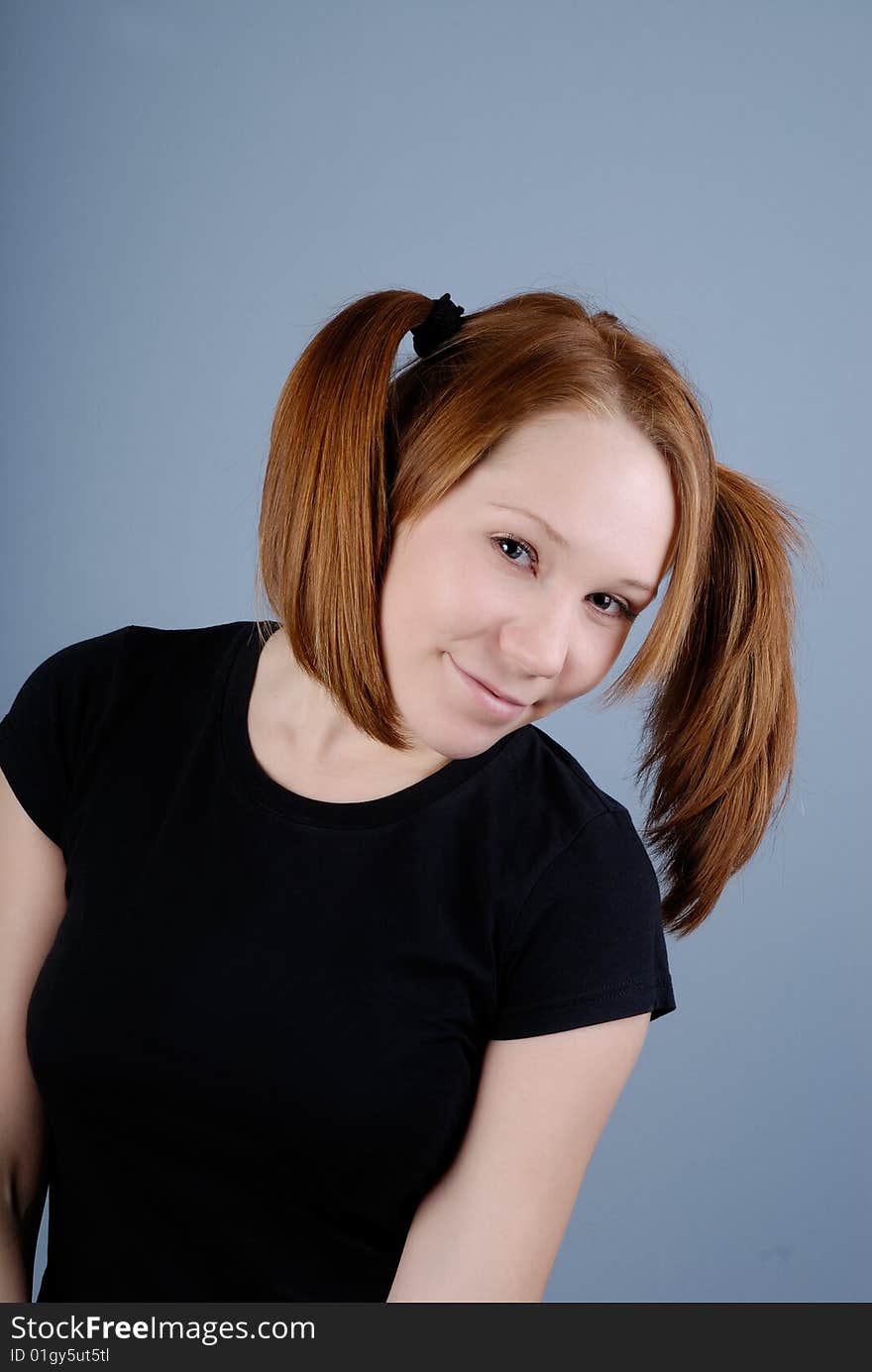 Portrait of a young beautiful woman with pigtail