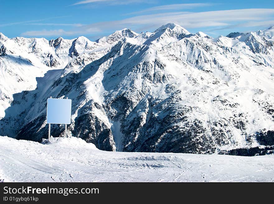 Clear board and snowy Alps as background (Solden, Austria). Clear board and snowy Alps as background (Solden, Austria)